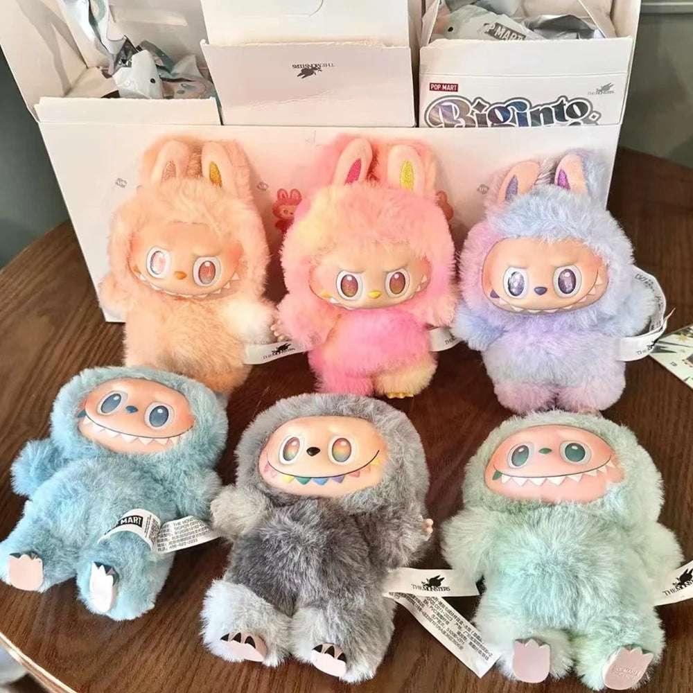 Pastel collectible plush toys and games collection featuring six fuzzy character dolls with bunny ears and monster faces